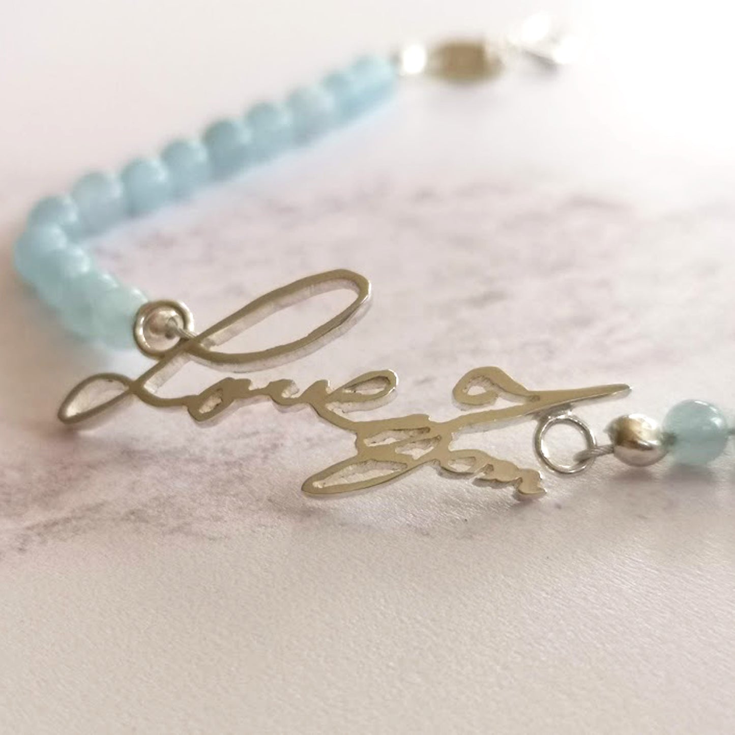 Handwriting bracelet with aquamarine gemstone beads