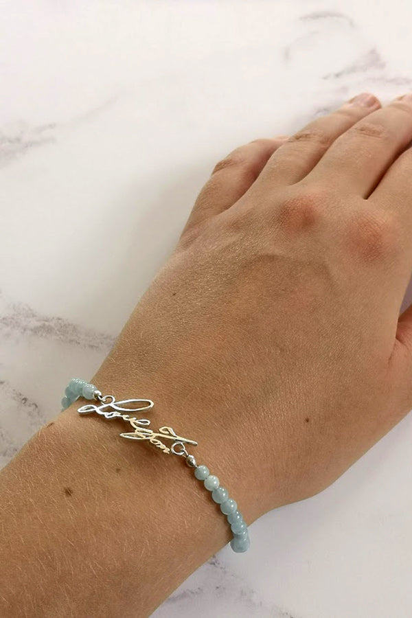 Handwriting and aquamarine bracelet